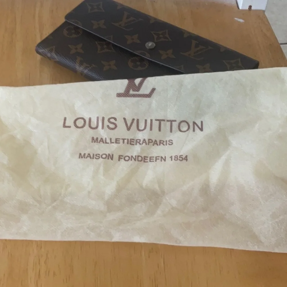 LVBrown Monogram Canvas Continental Wallet - Picture 6 of 7